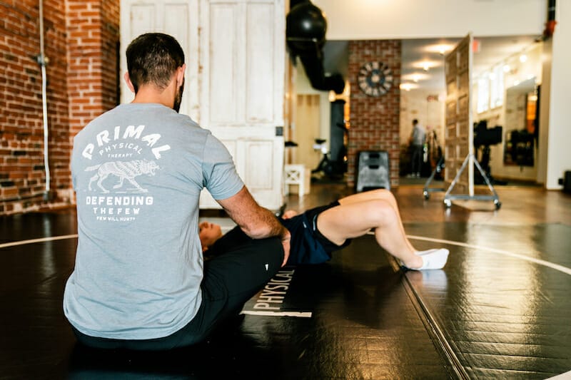 physical-therapy-villanova-pa physical therapist in Villanova PA working patient on mat