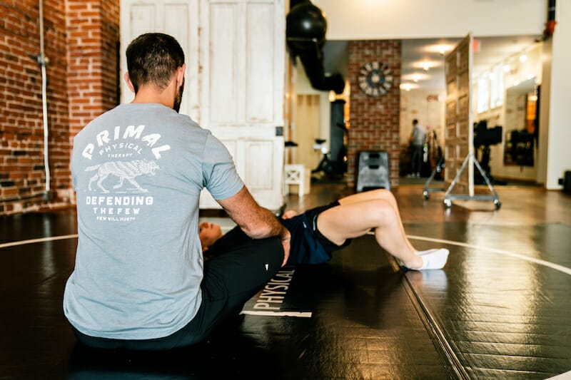 physical therapist in Villanova PA working patient on mat