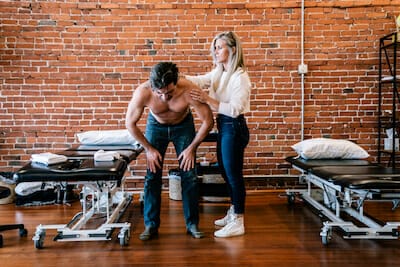 Physical therapist JJ Thomas working with patient at Villanova physical therapy clinic