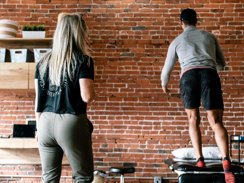 physical therapist working with patient to strengthen calf muscles