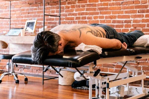 dry needling patient on table at main line physical therapy clinic Primal Physical Therapy