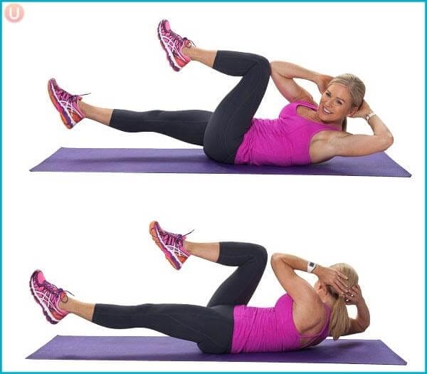 Pilates Criss Cross Bicycle physical therapy Exercise performed by a woman on pink shirt